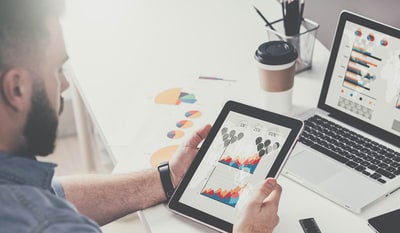 The UNSW graduate diploma in applied finance online student is looking at his ipad