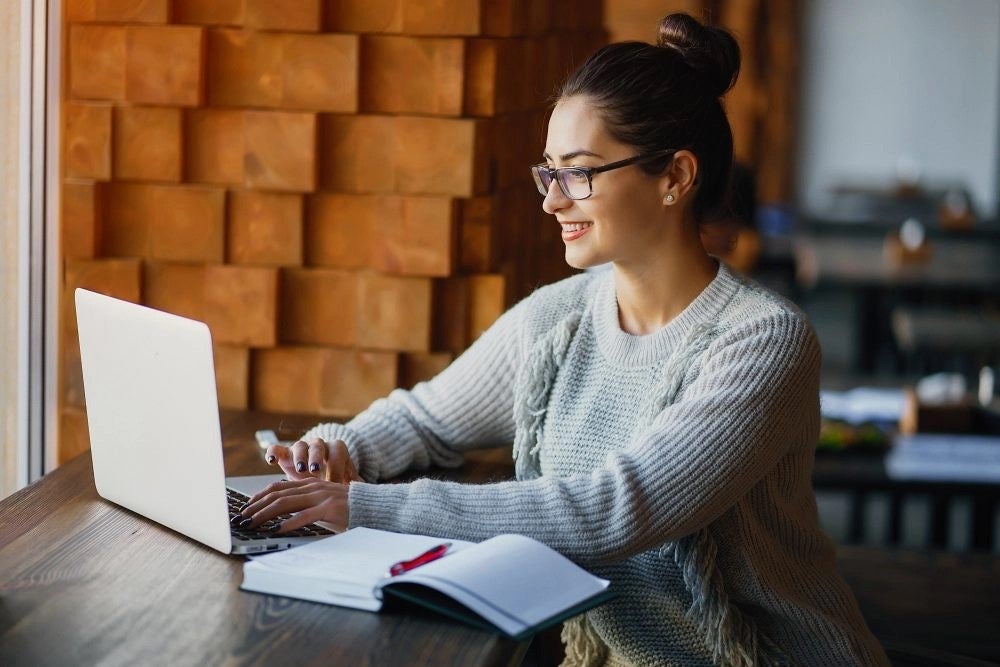 A cyber security expert working on a laptop