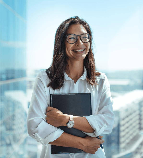 Woman holding laptop smiling