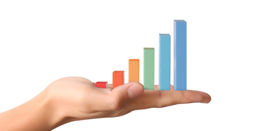 Image of a bar chart on a palm of a hand.