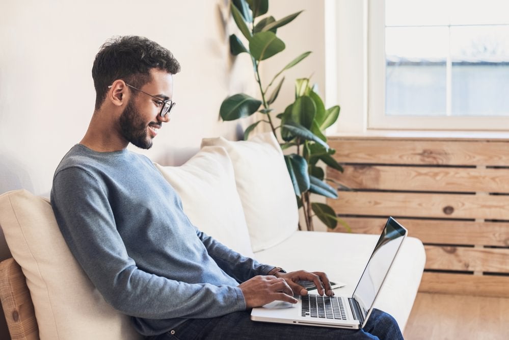A cyber security professional working on a laptop
