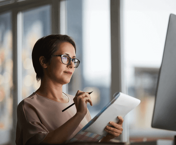 Woman writing on a note pad