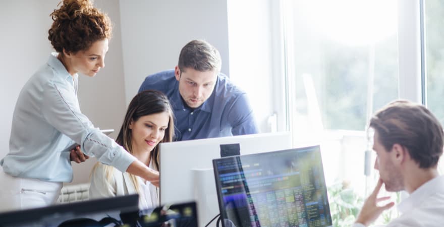 A group of colleagues collaborating together on a project.