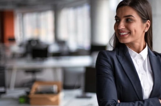 A smiling CFO with her arms crossed