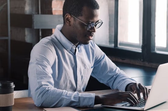 A finance expert working on laptop