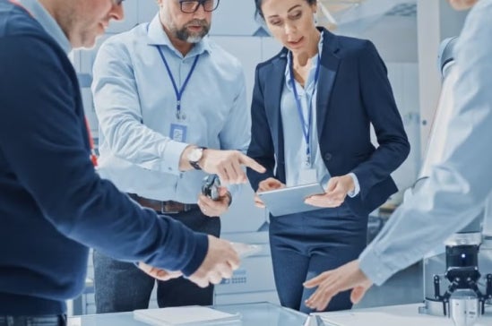 A group of data scientists and data analyts in a discussion at work