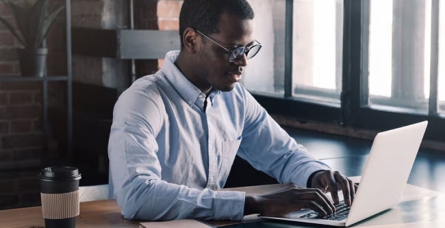 A finance expert working on laptop