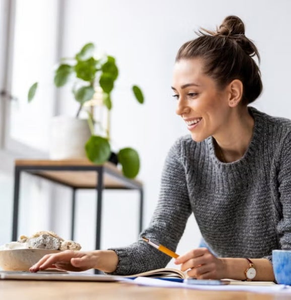 A fintech professional working on her laptop